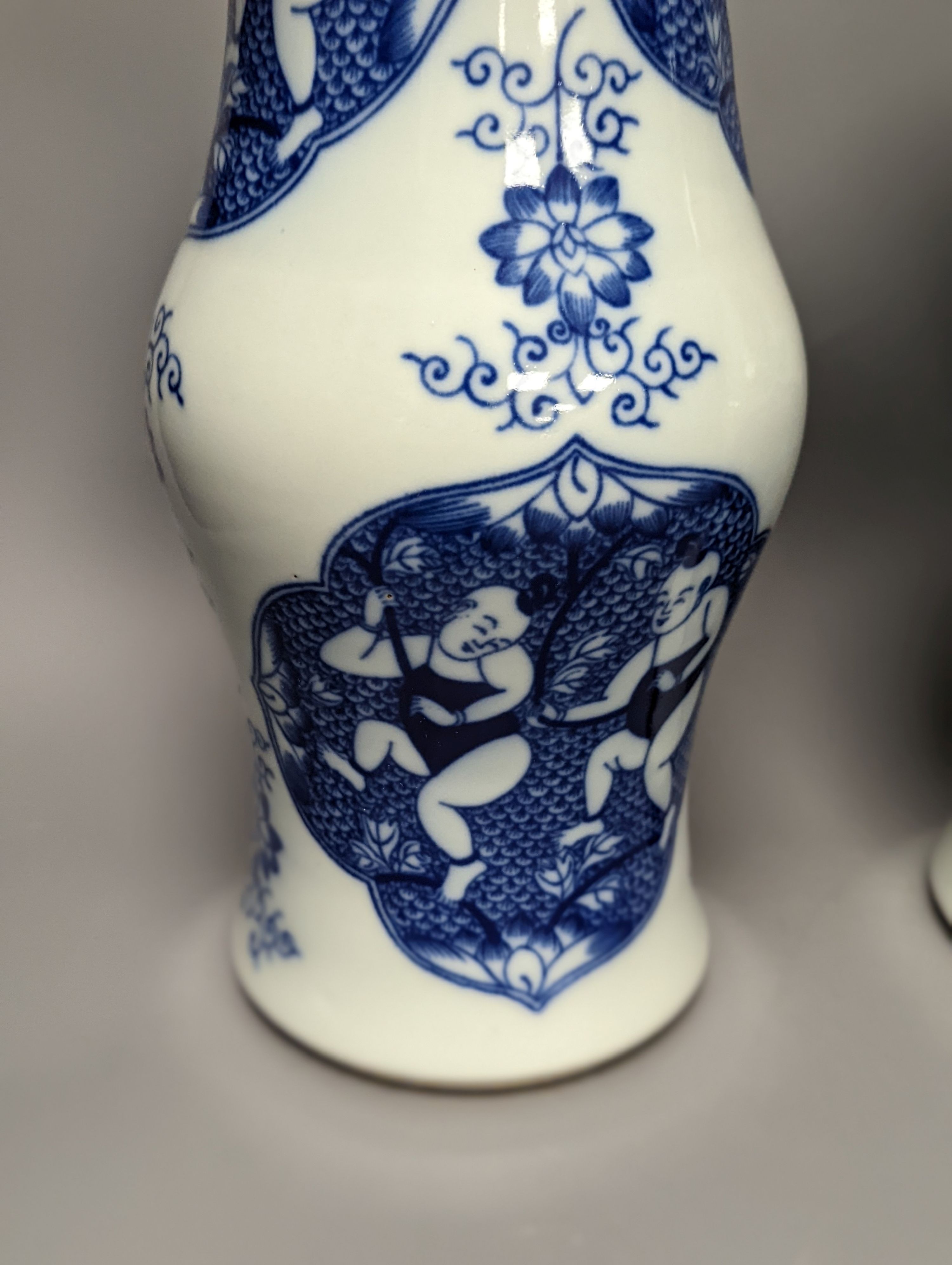 A pair of Chinese blue and white vases on stands and 6 further wood stands. Vases 35cm